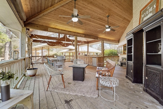 wooden deck featuring a ceiling fan