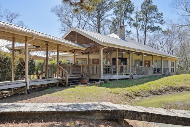 exterior space featuring a lawn and a chimney