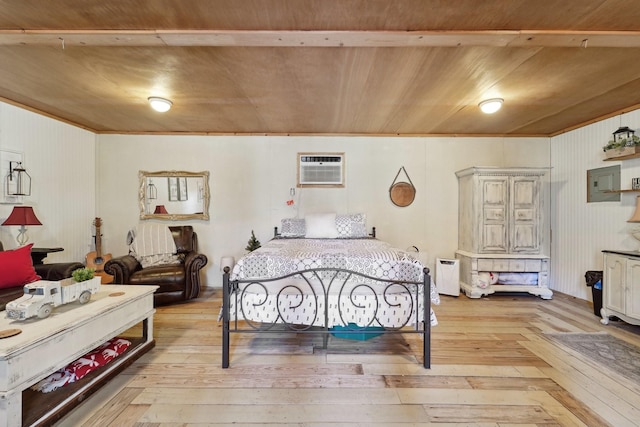 bedroom featuring light wood-style flooring and a wall mounted AC