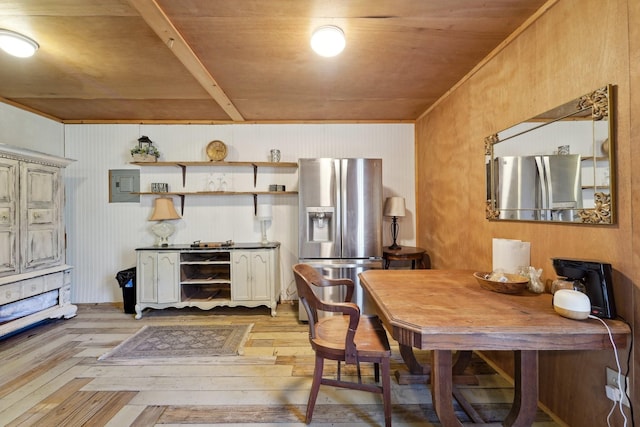 dining room featuring electric panel and light wood-style floors