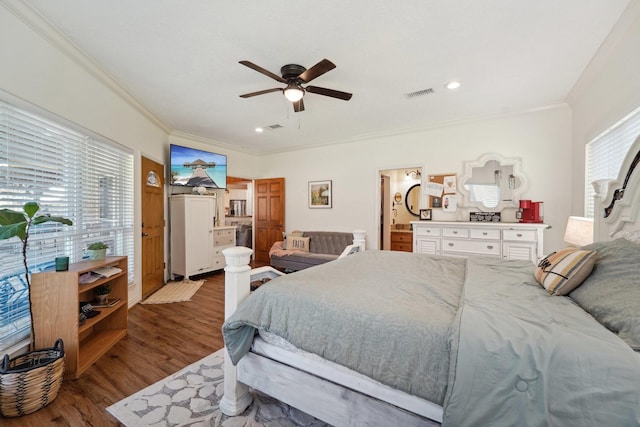 bedroom with visible vents, crown molding, ceiling fan, recessed lighting, and wood finished floors