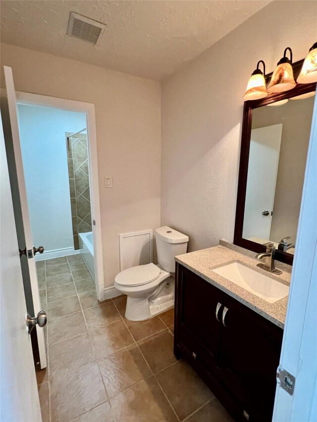 full bath with visible vents, toilet, a textured ceiling, tile patterned flooring, and vanity