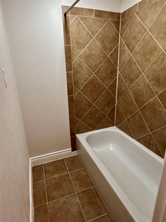 bathroom with tile patterned floors and baseboards