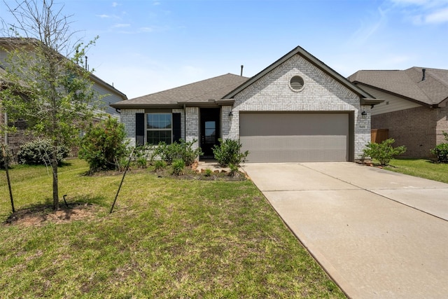 5431 Tourmaline Way, Brookshire, TX 77423 - view of front of property featuring brick siding, an attached garage, concrete driveway, a front yard, and a shingled roof