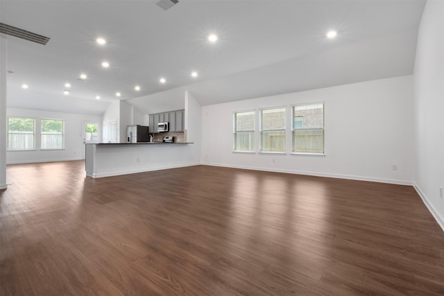 5431 Tourmaline Way, Brookshire, TX 77423 - unfurnished living room with lofted ceiling, recessed lighting, baseboards, and dark wood finished floors