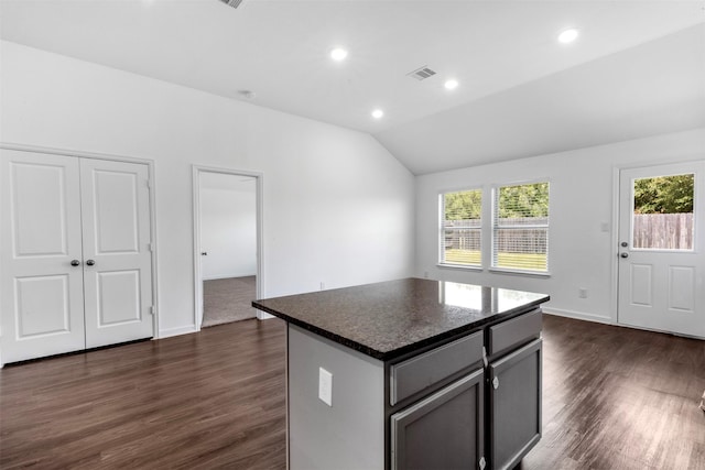 5431 Tourmaline Way, Brookshire, TX 77423 - kitchen with healthy amount of natural light, vaulted ceiling, a kitchen island, dark wood-style floors, and recessed lighting