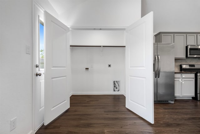5431 Tourmaline Way, Brookshire, TX 77423 - laundry room with electric dryer hookup, washer hookup, dark wood-style flooring, and baseboards