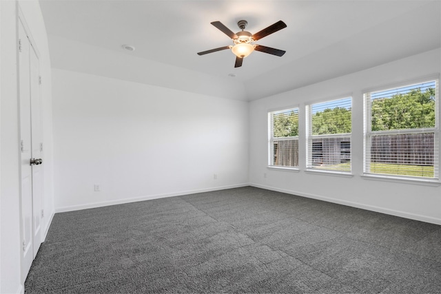 5431 Tourmaline Way, Brookshire, TX 77423 - spare room featuring dark carpet, ceiling fan, baseboards, and lofted ceiling