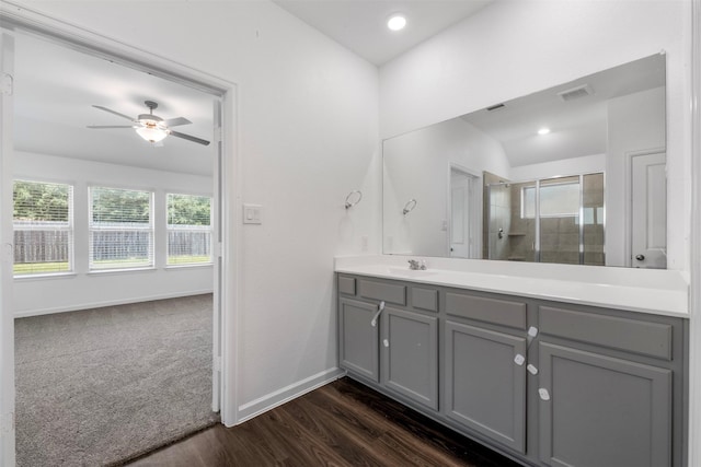 5431 Tourmaline Way, Brookshire, TX 77423 - bathroom featuring ceiling fan, vanity, a shower stall, wood finished floors, and baseboards