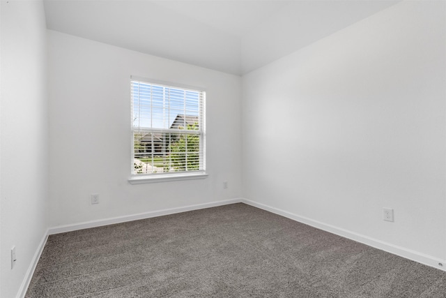 5431 Tourmaline Way, Brookshire, TX 77423 - spare room featuring dark carpet and baseboards