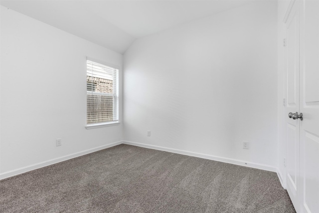 5431 Tourmaline Way, Brookshire, TX 77423 - unfurnished room with dark carpet, vaulted ceiling, and baseboards