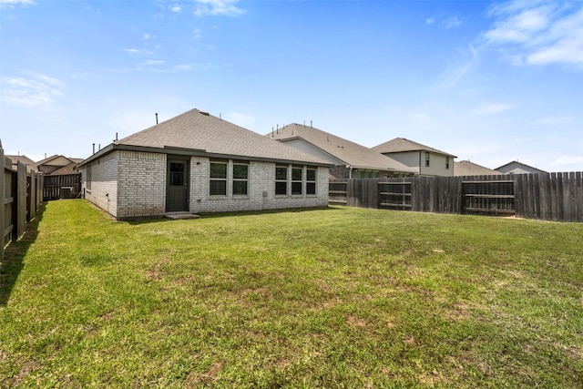 5431 Tourmaline Way, Brookshire, TX 77423 - back of property featuring brick siding and roof with shingles