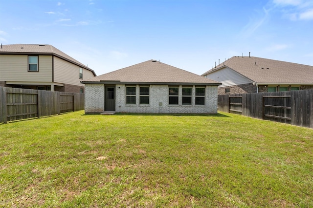 5431 Tourmaline Way, Brookshire, TX 77423 - back of property featuring brick siding and a shingled roof