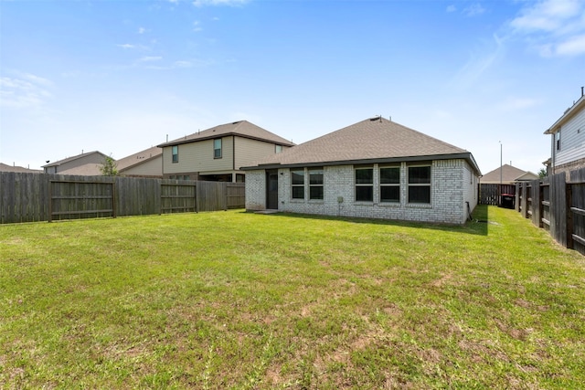 5431 Tourmaline Way, Brookshire, TX 77423 - rear view of property with brick siding and a shingled roof