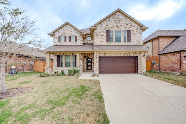 view of front of house with a shingled roof, a front lawn, fence, a garage, and driveway