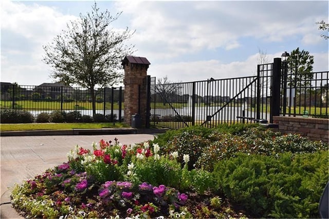 view of gate with fence