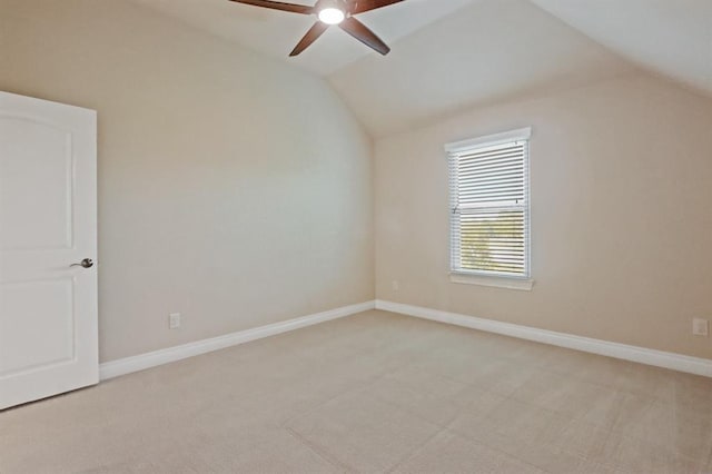 bonus room with vaulted ceiling, a ceiling fan, light carpet, and baseboards