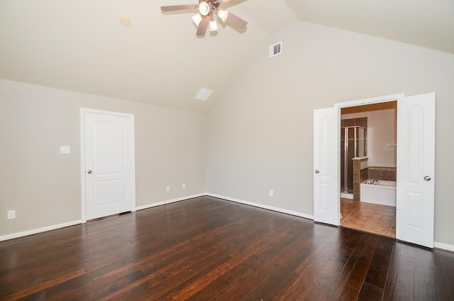 unfurnished room with visible vents, baseboards, dark wood finished floors, vaulted ceiling, and a ceiling fan