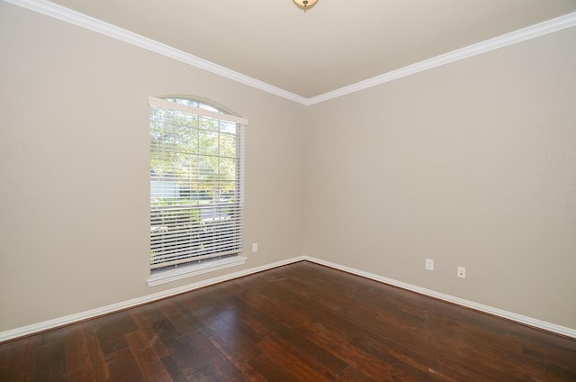 empty room with baseboards, dark wood finished floors, and ornamental molding