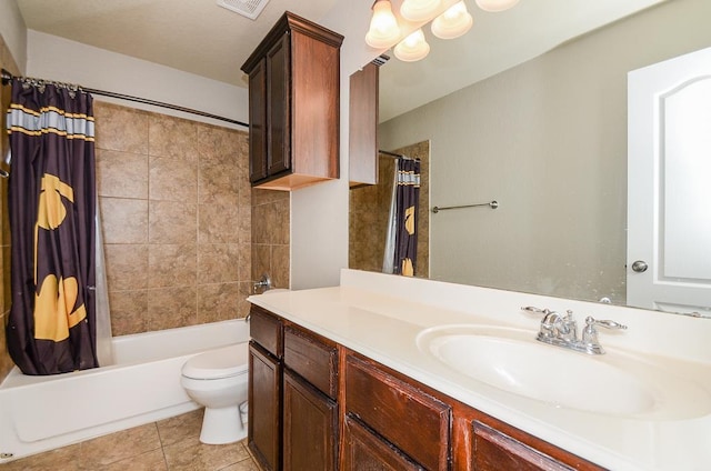 bathroom with tile patterned floors, toilet, vanity, and shower / bath combination with curtain