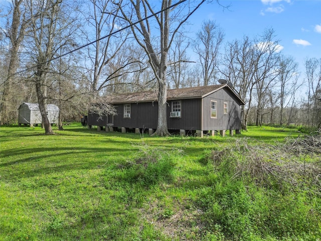 exterior space featuring a yard and cooling unit