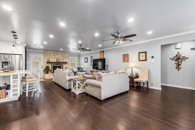 living room featuring crown molding, baseboards, ceiling fan, dark wood finished floors, and recessed lighting