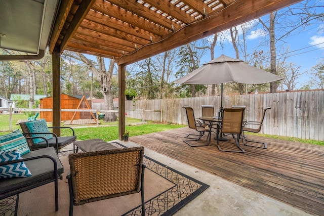 view of patio with a fenced backyard, a pergola, outdoor dining area, and a deck