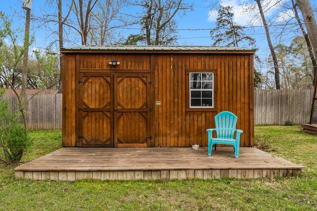 view of shed featuring a fenced backyard