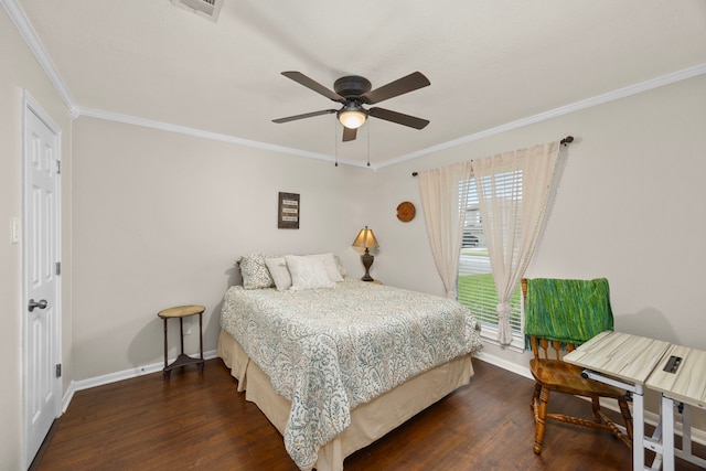 bedroom featuring baseboards, dark wood-style floors, and crown molding