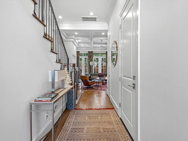 entryway with coffered ceiling, recessed lighting, ornamental molding, hardwood / wood-style flooring, and beamed ceiling