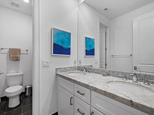 bathroom featuring a sink, visible vents, and tile patterned flooring