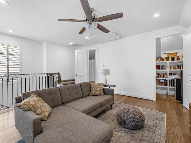 living room with baseboards, attic access, recessed lighting, wood finished floors, and a ceiling fan