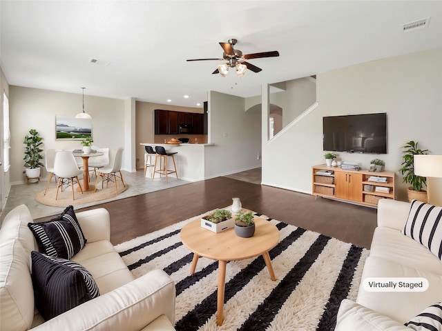 living area featuring recessed lighting, wood finished floors, visible vents, and ceiling fan