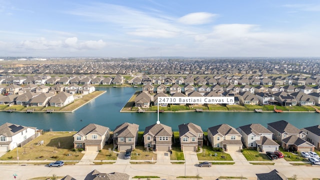 birds eye view of property featuring a residential view and a water view