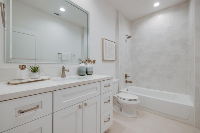 bathroom with visible vents, toilet, vanity, tile patterned flooring, and shower / bathtub combination