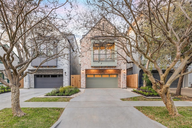 view of front of house with concrete driveway, a balcony, an attached garage, and brick siding