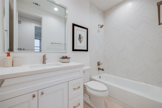 bathroom featuring visible vents, toilet, vanity, and shower / tub combination