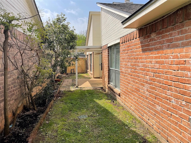 view of yard featuring a fenced backyard and a patio area