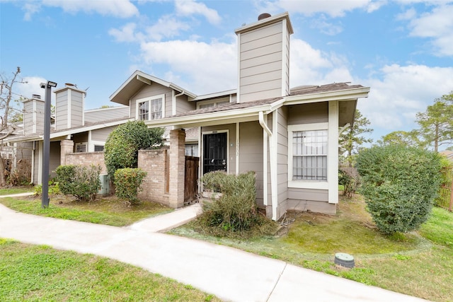 townhome / multi-family property with a chimney