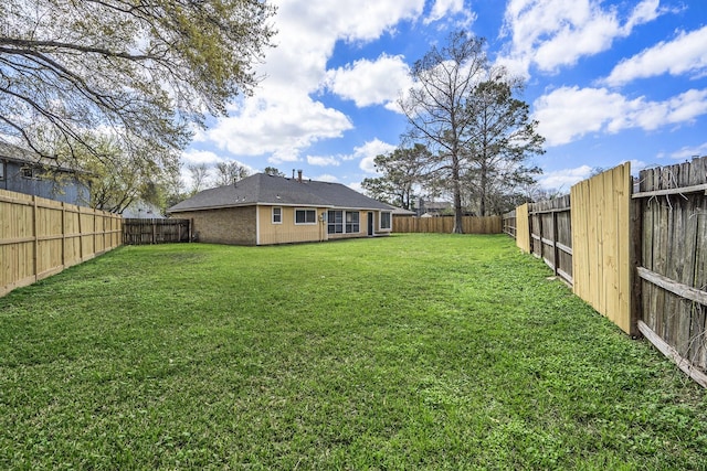 view of yard featuring a fenced backyard