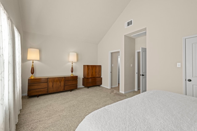 carpeted bedroom featuring visible vents, baseboards, and high vaulted ceiling