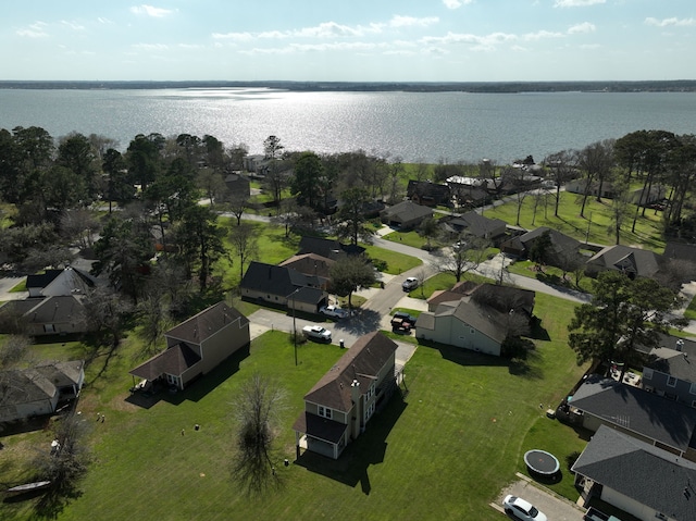 drone / aerial view with a residential view and a water view