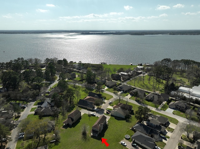 drone / aerial view with a water view and a residential view