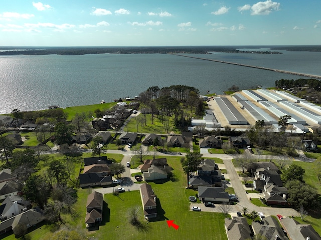 aerial view with a residential view and a water view