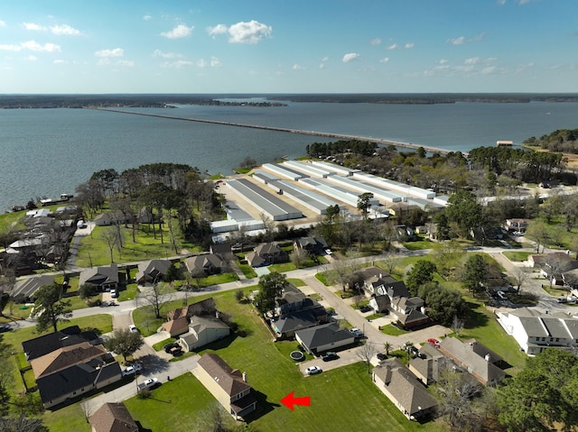 birds eye view of property featuring a residential view and a water view