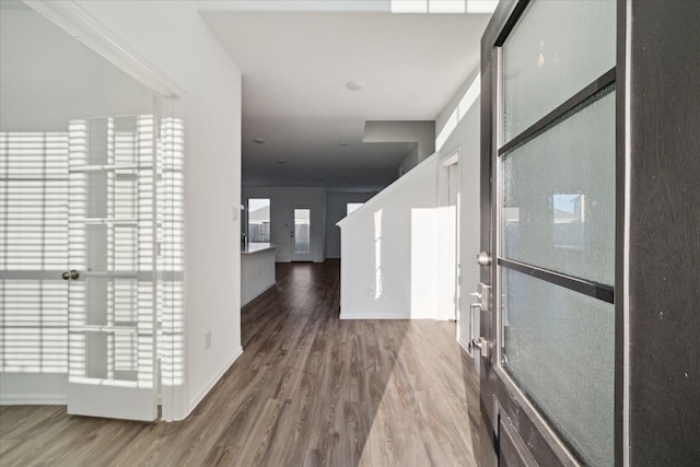 corridor with wood finished floors