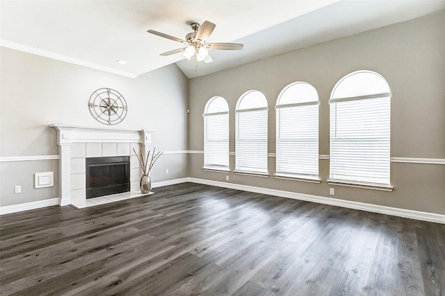 unfurnished living room featuring dark wood-type flooring, baseboards, and ceiling fan