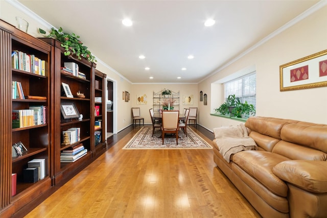 interior space featuring recessed lighting, light wood-style flooring, baseboards, and ornamental molding