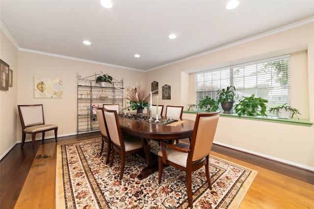 dining area with recessed lighting, baseboards, wood finished floors, and ornamental molding