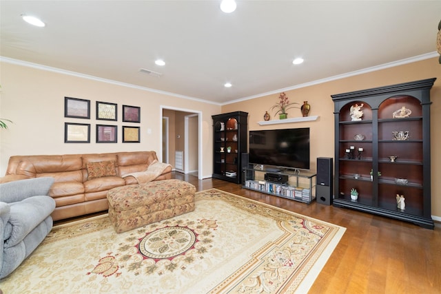 living area featuring recessed lighting, wood finished floors, visible vents, and ornamental molding